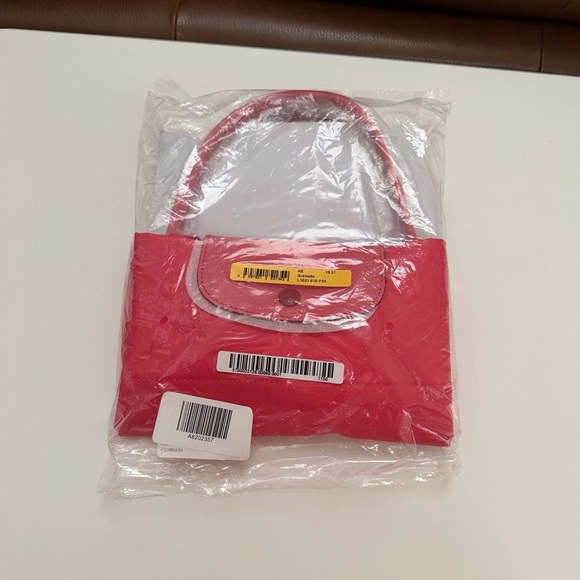 Longchamp top handle short handle tote
Grenade
L1623619P35 - Picture 7 of 12